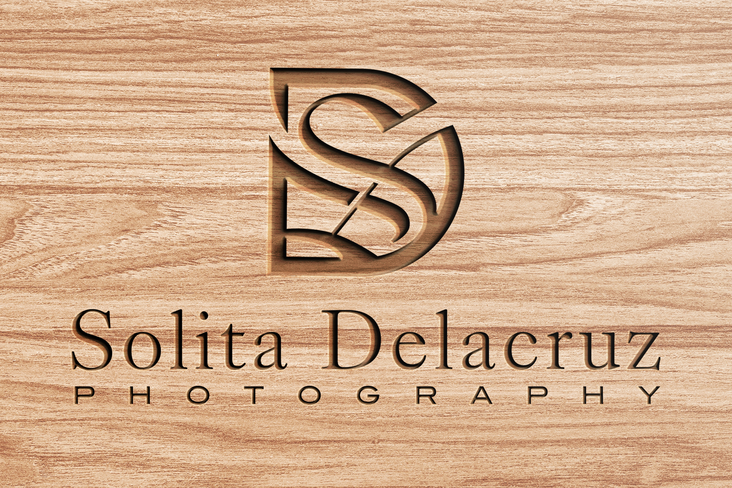 Alanté Baugh vintage AB monogram in gold inside a coin frame on a textured coral pink ground, wordmark below in matching gold display type with dropshadow